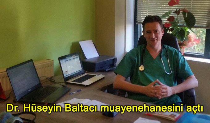 Dr. Hüseyin Baltacı seated at his consultation desk in his private medical practice in Xanthi